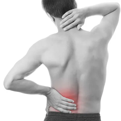 Person holding their lower back