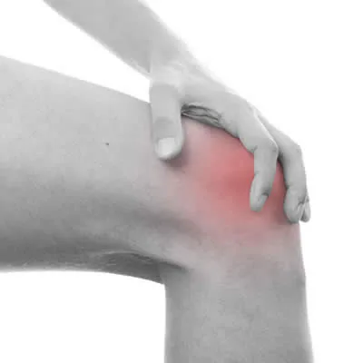Person supporting a painful knee