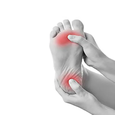 Person holding the sole of their foot