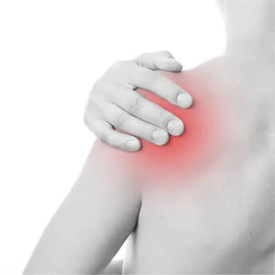 Person holding a painful shoulder